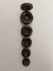 Der hochwertiger Knopf, glänzend 